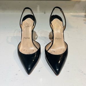 Christian Louboutin Black Patent Slingback pumps.